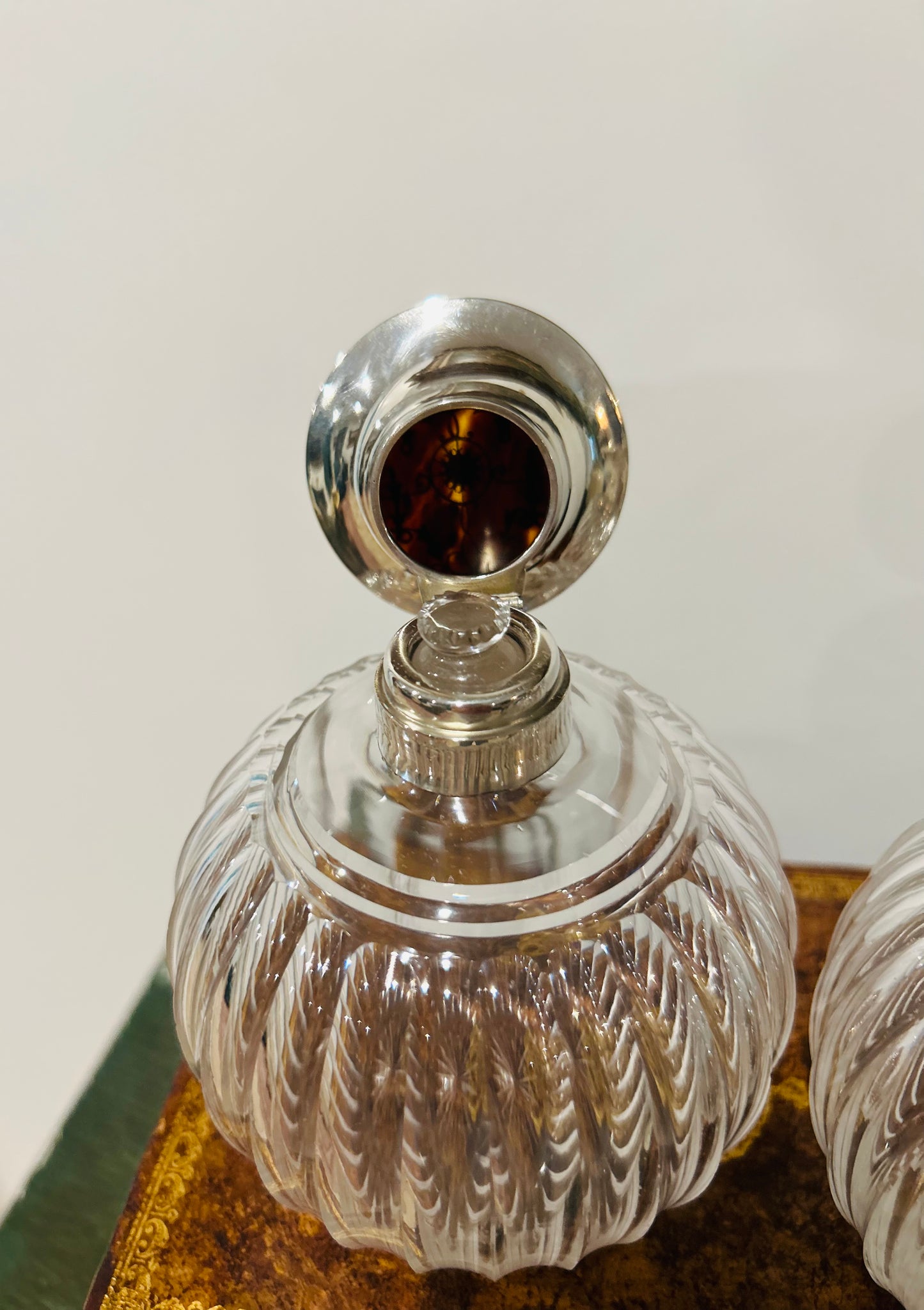 Pair of antique perfume bottles with tortoiseshell & sterling silver caps