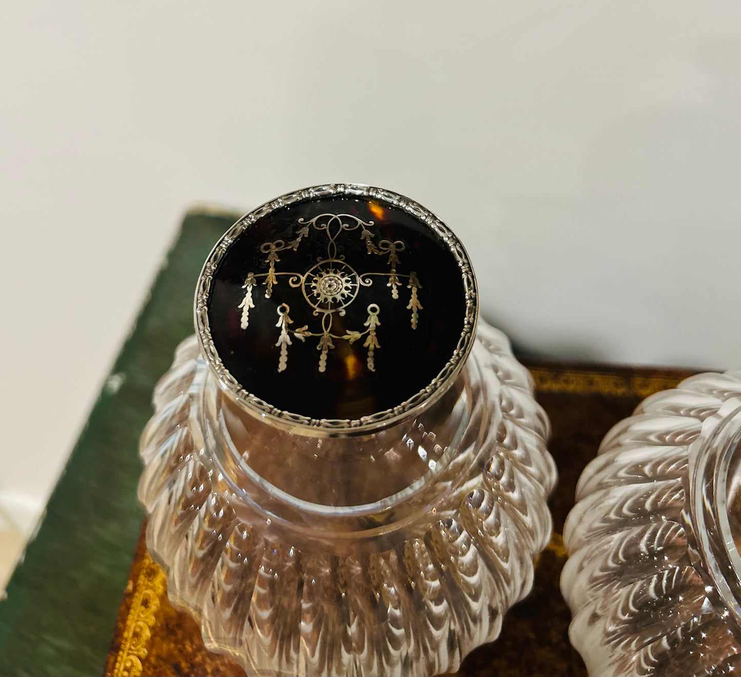 Pair of antique perfume bottles with tortoiseshell & sterling silver caps