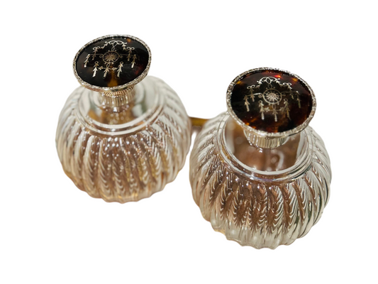 Pair of antique perfume bottles with tortoiseshell & sterling silver caps